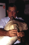 Nikitas Tsimouris playing a tsambouna - Tarpon Springs, Florida