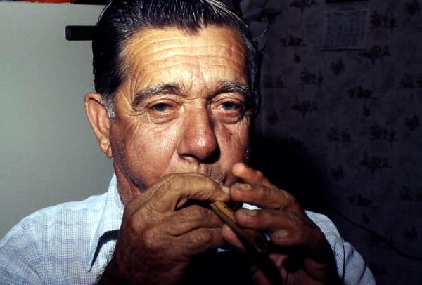 Nikitas Tsimouris playing a "practice chanter" - Tarpon Springs, Florida