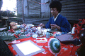 Kazuko Law making origami at the Great Gulf Coast Arts Festival- Pensacola, Florida.