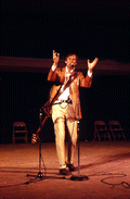 Gamble Rogers telling a story at the 1985 Florida Folk Festival - White Springs, Florida