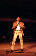 Gamble Rogers telling a story at the 1985 Florida Folk Festival - White Springs, Florida
