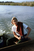 Fieldworker Nancy Nusz at stern of Folsom's oyster skiff.