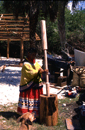 Susie Jim Billie pounds corn - Ochopee, Florida