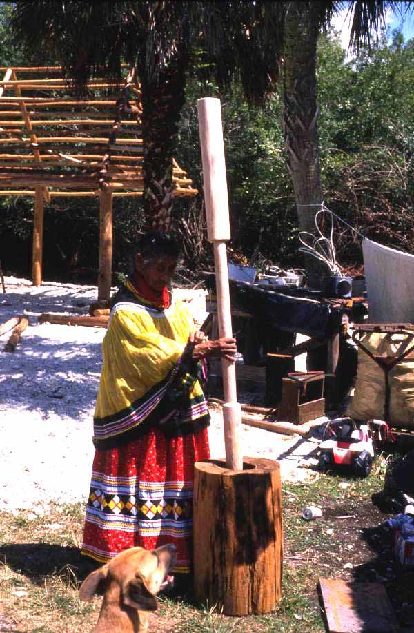 Susie Jim Billie pounds corn - Ochopee, Florida