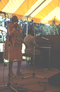 Mary McClain sings while Willie James plays piano - White Springs, Florida