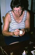 Evelyn Coskey working with stylus during Polish egg decoration (pysanky) - Starke, Florida