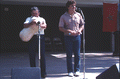 Nikitas Tsimouris plays a tsambouna while Tony Tsimouris talks - White Springs, Florida