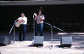 Nikitas Tsimouris playing a tsambouna while his son Tony claps along - White Springs, Florida