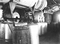 Rosin being run into metal-topped collapsible barrels.