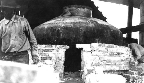 Beginning of brick arch over chimney throat of still