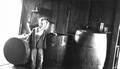 C.B. Harrison Jr. standing next to his father's still