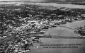Aerial view showing railroad and highway bridges across St. Johns River - Jacksonville, Florida.
