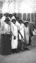 Group of midwives posing on church steps