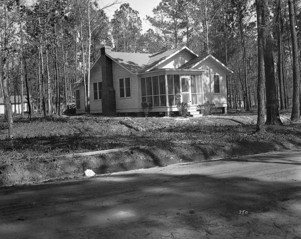 One of over seventy residences at Camp Roosevelt built originally to house workers for the Cross-Florida Barge Canal project. Many of these homes were later sold to private citizens and became part of the Roosevelt Village neighborhood (photo circa 1936).