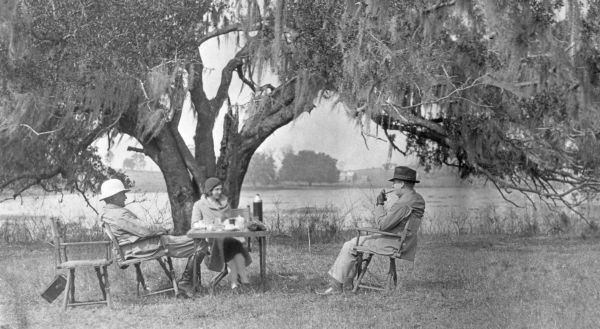 Col. Griscom and Audrey Griscom at lunch on the lawn beside Lake Iamonia