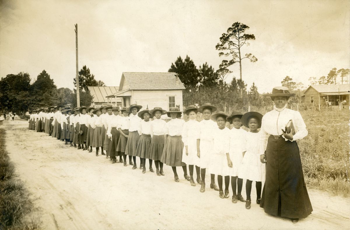 Mary McLeod Bethune with a line of girls from the school