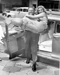 Newt Perry carrying Nancy Tribble wearing her tail - Tampa, Florida.