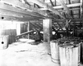 Deck of still loaded with barrels of scrape ready for stilling