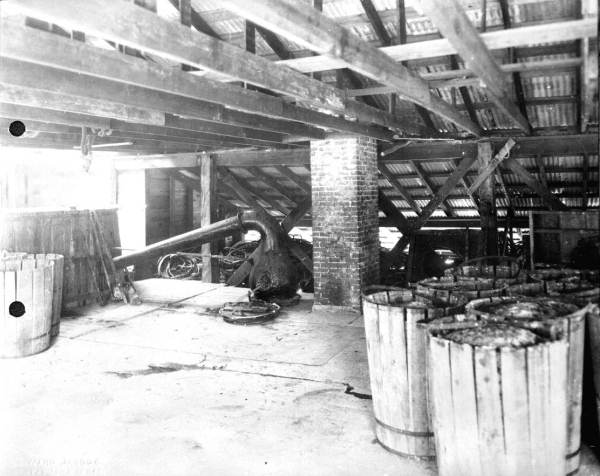 Deck of still loaded with barrels of scrape ready for stilling