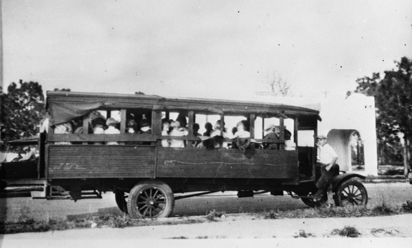 A wooden-bodied school bus on Okeechobee Road in Fort Pierce (1925).