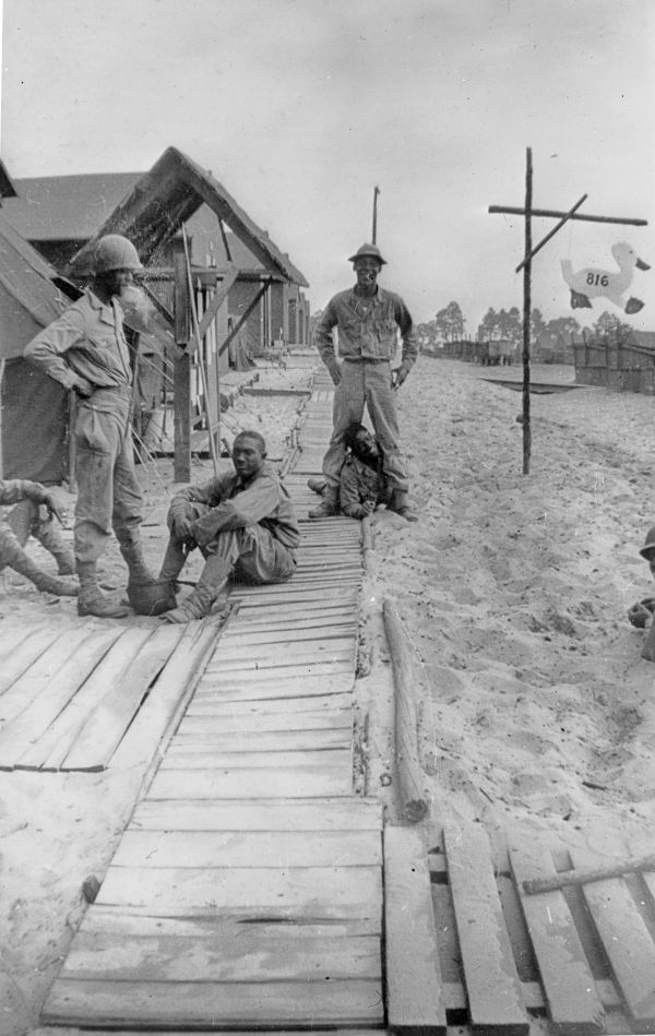 African-American soldiers in front of barracks at Camp Gordon Johnston (circa 1943).