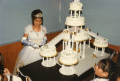 Young woman cutting her cake during the Quinceanera ceremony in Okeechobee.