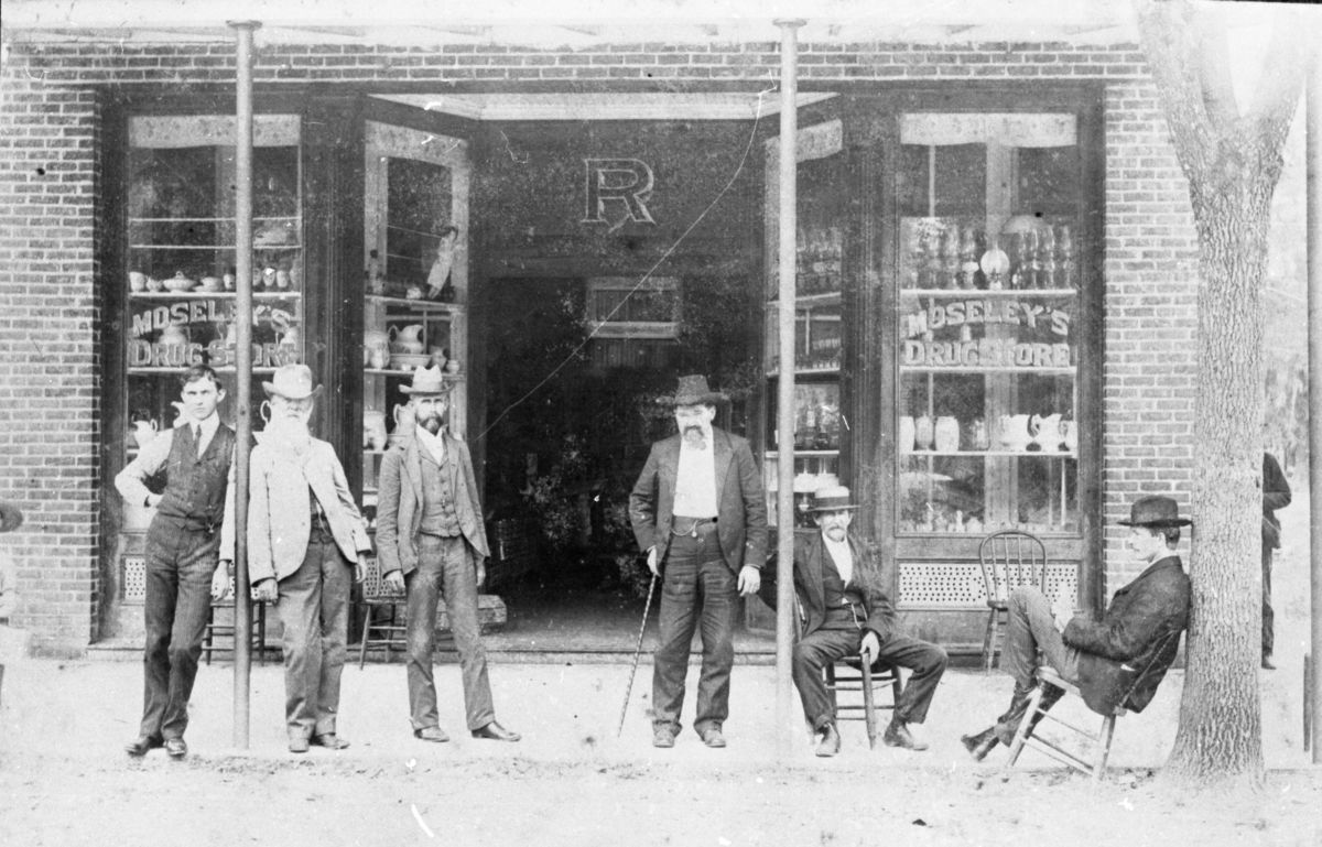 Group of men in front of Moseley's Drug Store, Madison. Dr. Alonzo Lashbrook Blalock, third from left.