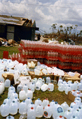 Close-up view showing bottles of water for Hurricane Andrew victims - Dade County, Florida.