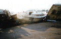 Close-up view showing the "Knot Me" and other boats damaged during Hurricane Andrew - Dade County, Florida.