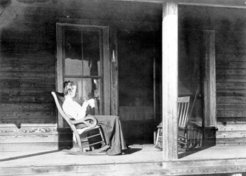 Henriette Martens sitting in a rocking chair on the porch of her home: Miami, Florida