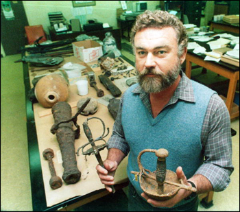Roger Smith, the State Archaeologist stands with some artifacts: Tallahassee, Florida (1987)