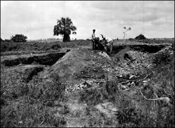 Screening the earth for artifacts at a village site in the Miami area : Florida (1935)