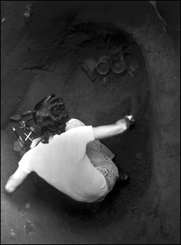 Daniel T. Penton excavating a cache of Indian ceramics (1973)