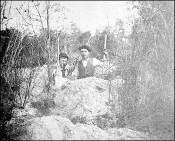 Two men at an indian mound (1892)