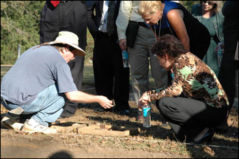 Mission San Luis archaeologist Jerry Lee showing work to Senate Committee on Governmental Oversight and Productivity tour members : Tallahassee, Florida (2005)