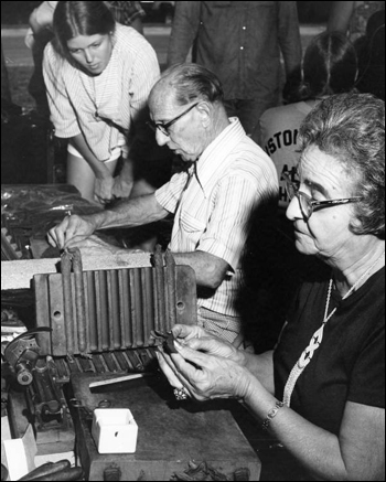 Faustino and Consuelo Fernandez of Tampa demonstrating cigar rolling at the 1977 Florida Folk Festival: White Springs, Florida (1977)