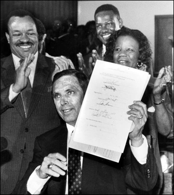 Governor Robert "Bob" Martinez signing Dr. Martin Luther King Jr. holiday measure into law in Tallahassee, Florida (May 31, 1988)