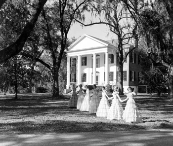 Young ladies in gowns welcome visitors to The Grove during the annual Tallahassee Trail tour of homes (1951)