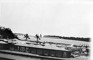 Sand-locked railroad cars after the 1926 hurricane: Lake Worth, Florida