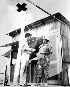 Mrs. Bishop discussing building plans with Red Cross worker after the 1935 hurricane