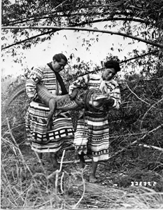 Two Seminoles and captured alligator (1920s)