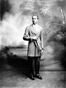 Portrait of blues clarinet player Raymond Sheppard holding a trumpet: Pensacola, Florida (between 1930 and 1949)