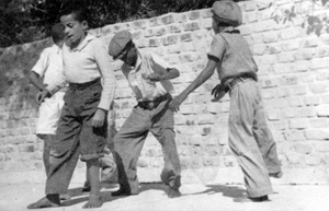 Four boys dancing in front of the Hemingway residence in Key West (1939)