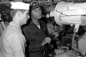 Florida Governor Bob Graham manning the helm of an aircraft carrier (1984)