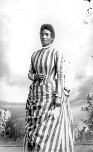 Woman in striped dress holding handkerchief