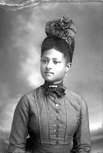 Young woman wearing fancy hat