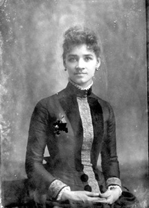 Woman in dress with embroidered front and cuffs