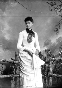 Young African American woman wearing a white dress