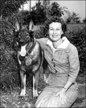 Outdoor portrait of the Governor's wife Mrs. Farris Bryant with the family dog (1961)