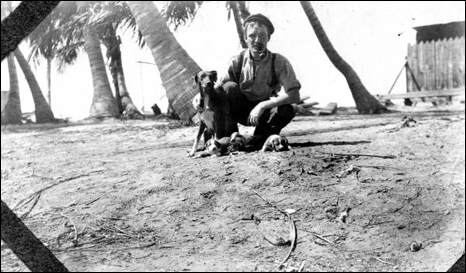 Construction worker with dog and puppies: Long Key, Florida (1907)